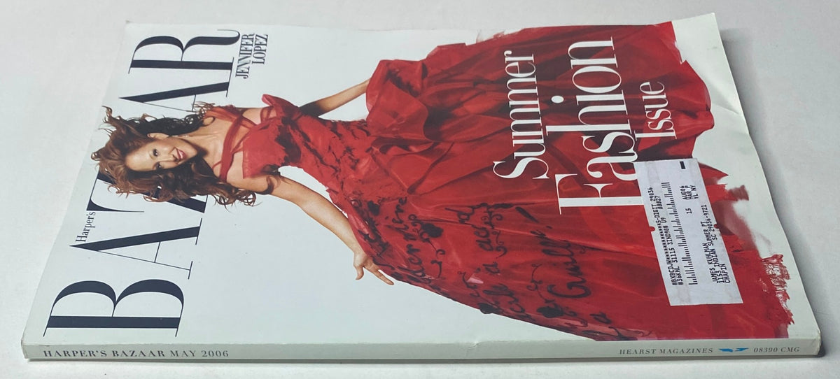 Harper's Bazaar Magazine May 2006 cover with Jennifer Lopez in a striking red dress, identified as the Summer Fashion Issue, displayed on a slightly bent magazine.