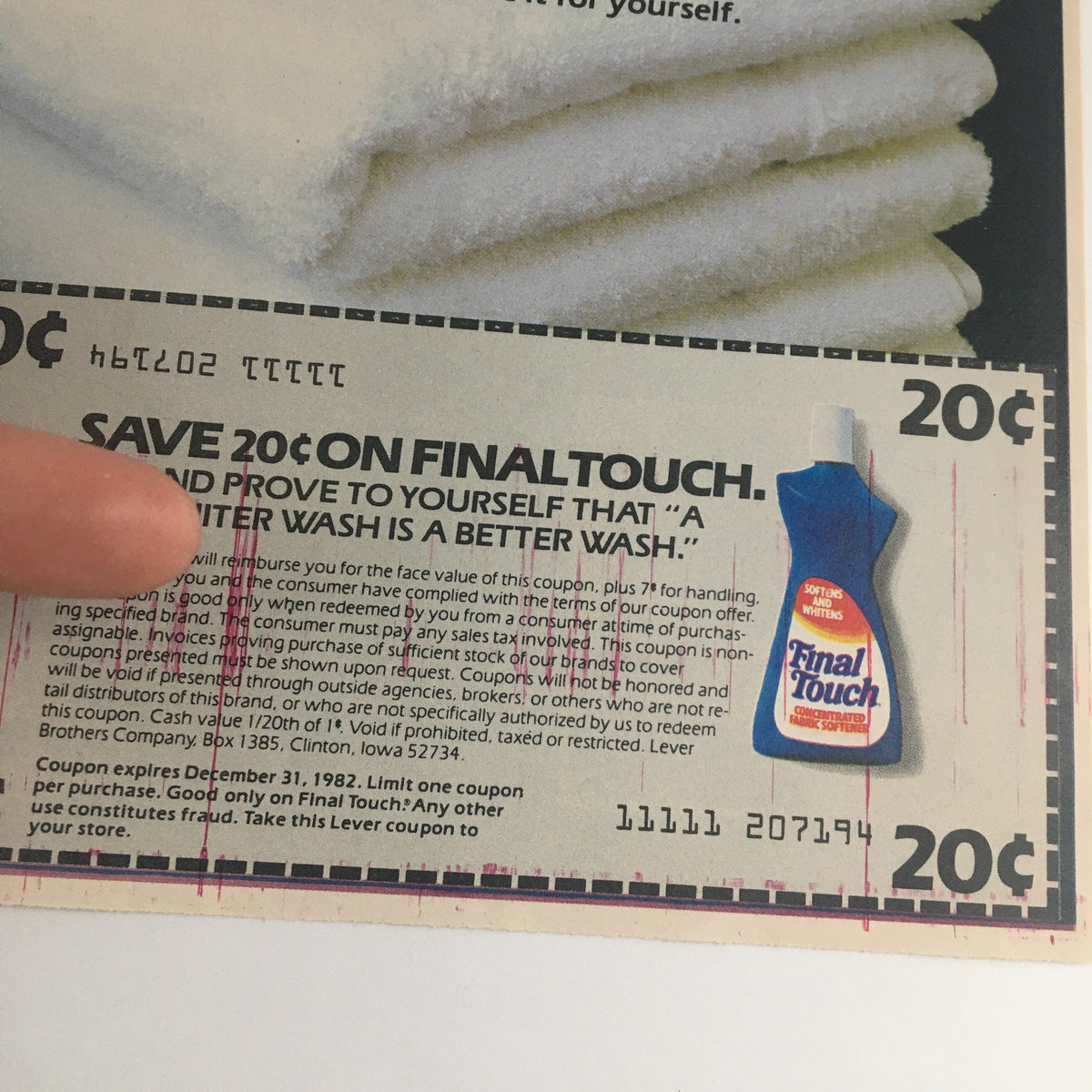 Close-up view of the 1982 Final Touch Concentrated Fabric Softener Circular Coupon with savings information and an advertisement highlighting the product's benefits for achieving a whiter wash.