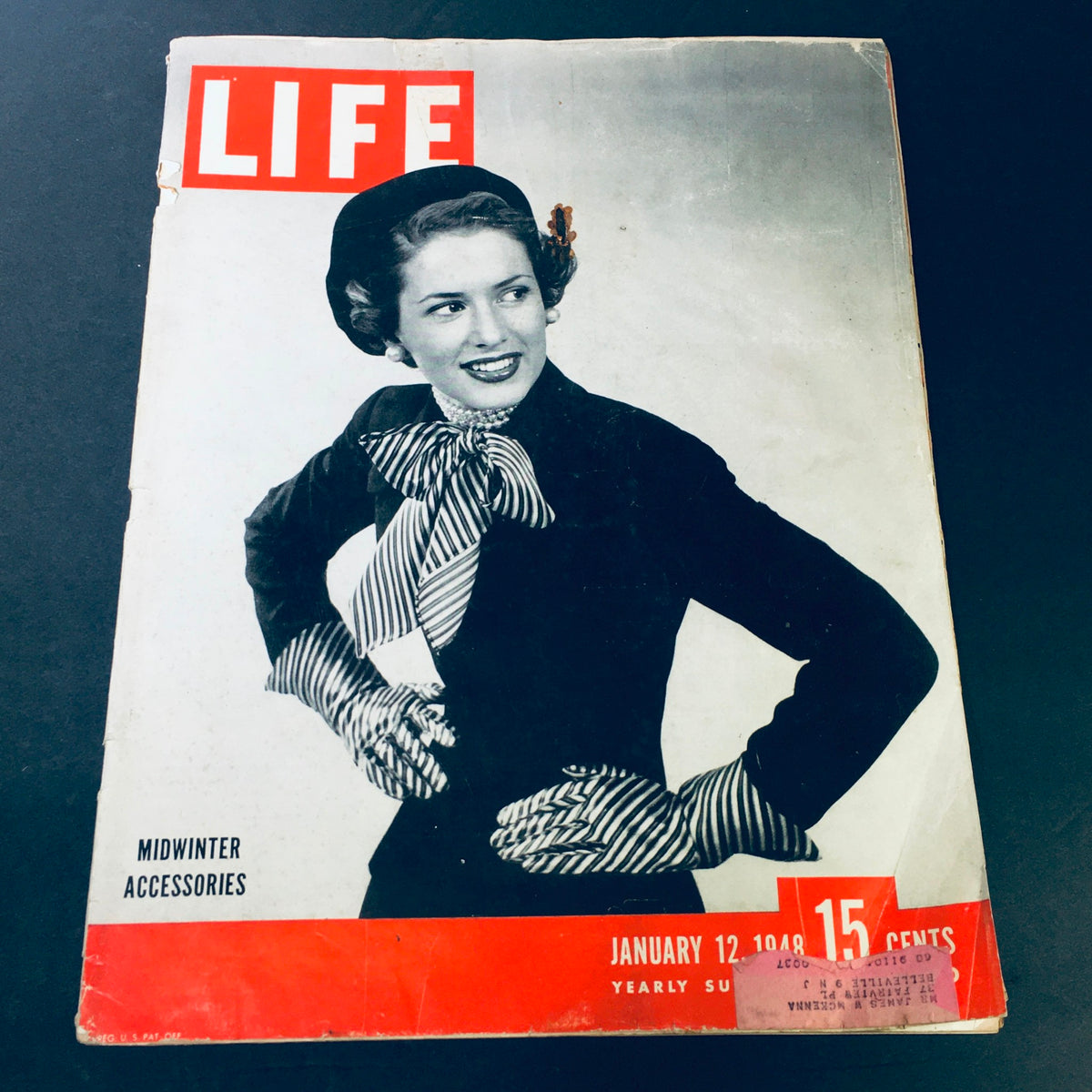 Cover of the vintage Life Magazine from January 12, 1948, featuring midwinter accessories and fashion trends from the 1940s. The cover displays a woman wearing a stylish ensemble with a bold striped bow and hat.