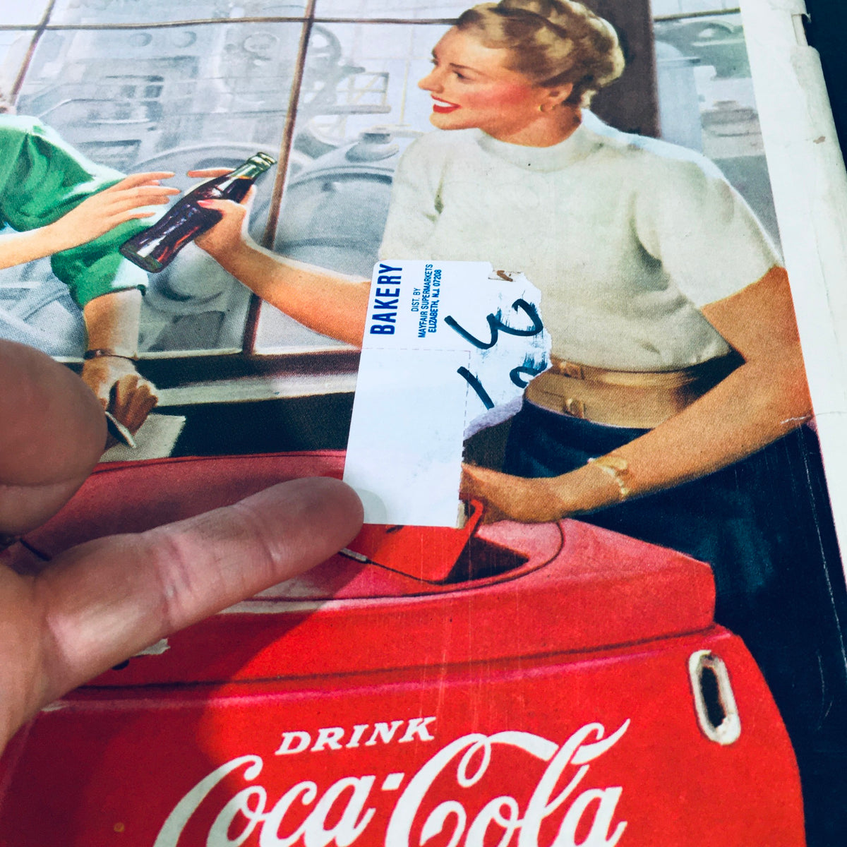 Image of a label on the vintage Life Magazine January 12, 1948, showcasing midwinter accessories, featuring a bakery sticker on the back cover, hinting at its previous ownership.