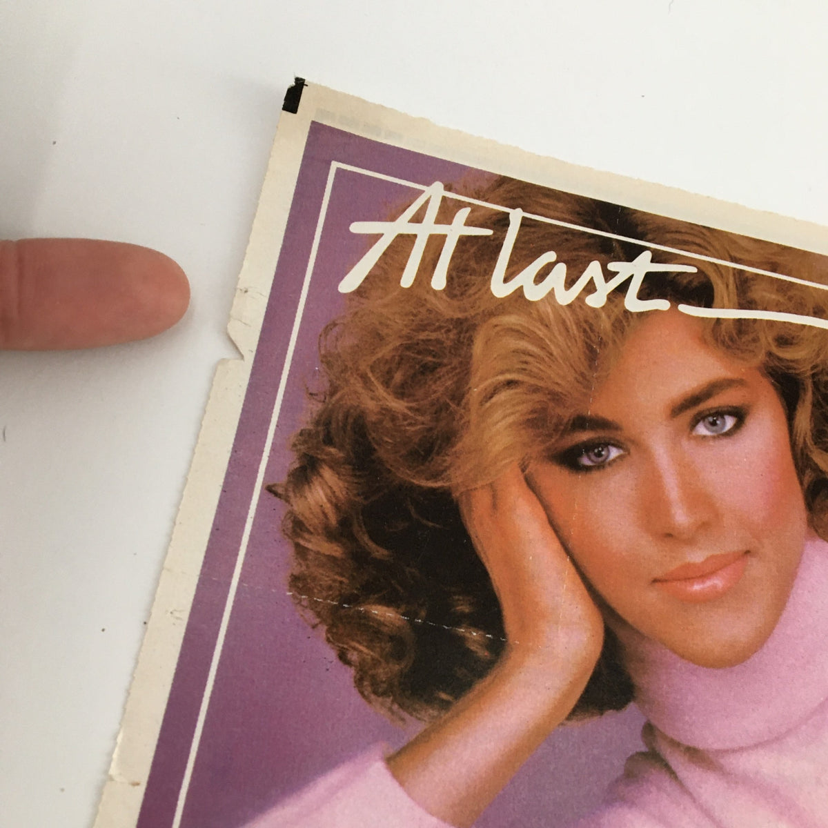 1984 Perma Soft Shampoo & Conditioner Circular Coupon Advertisement featuring a model with voluminous hair and a soft pink sweater, capturing the style and allure of 1980s hair care marketing.