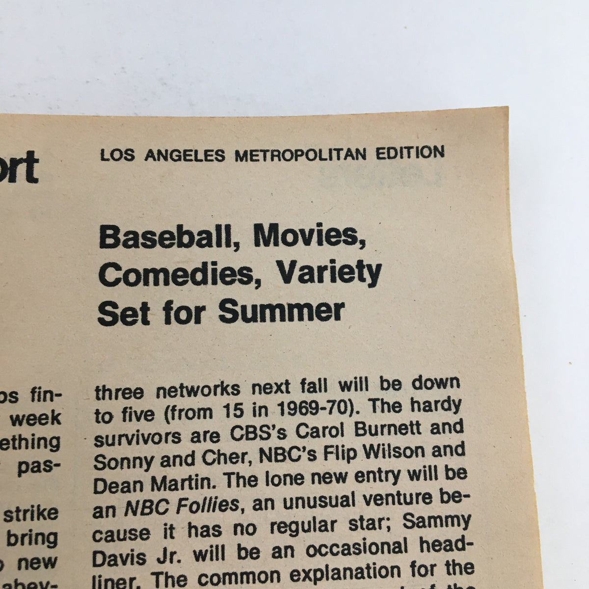 Close-up of a page from TV Guide Magazine April 28 1973, discussing summer programming including baseball, movies, and variety shows, illustrating the magazine's role in 1970s entertainment.