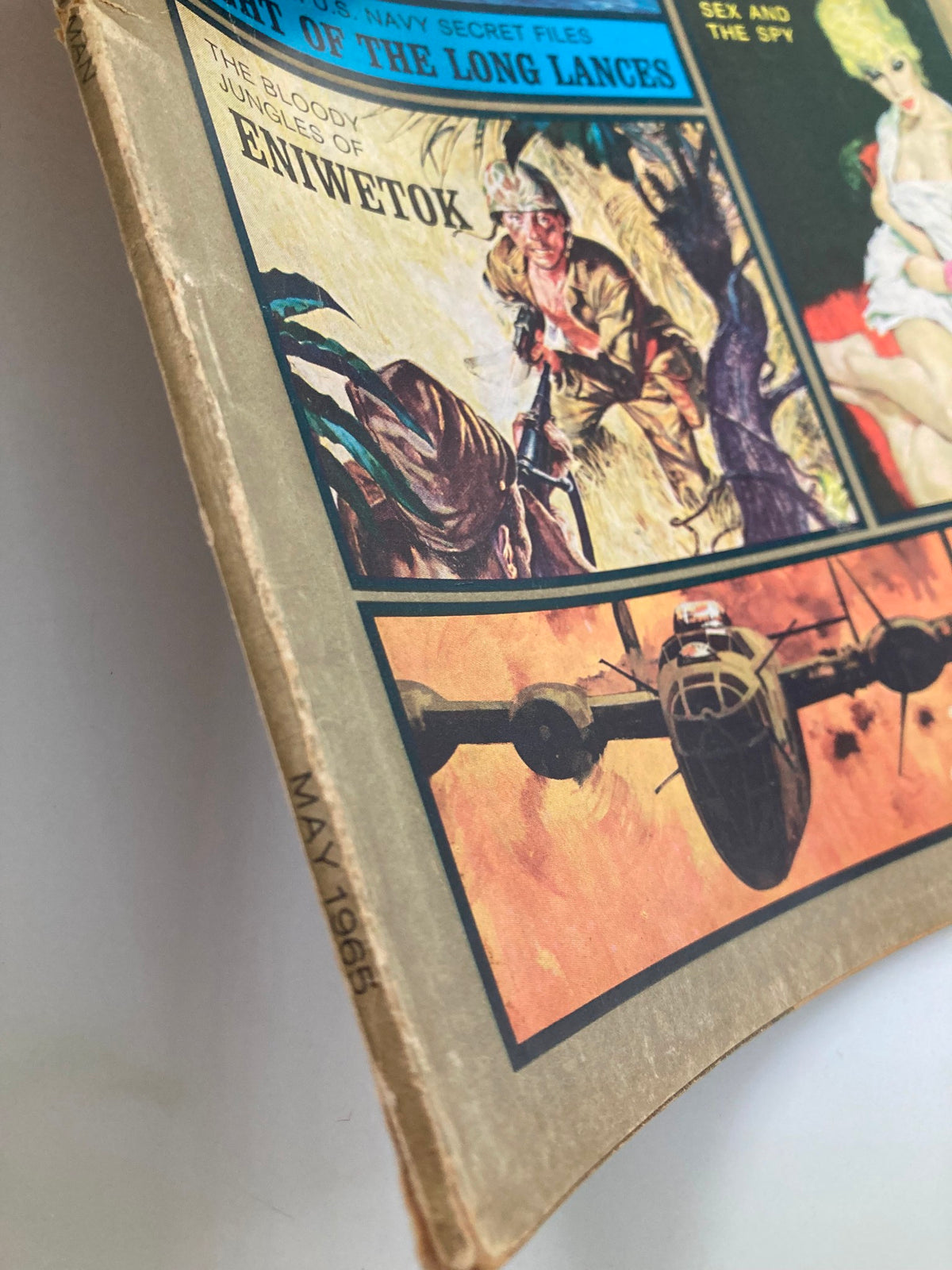 Close-up of the spine of The American Man Magazine, May 1965, showcasing the date and wear that highlights its vintage charm.