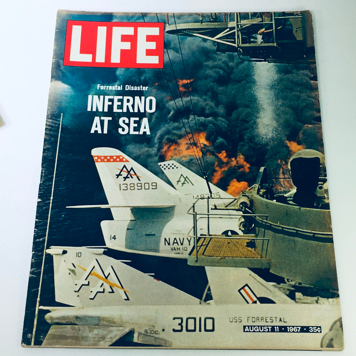 Cover of VTG Life Magazine August 11 1967 featuring the title 'USS Forrestal Disaster Inferno At Sea' over an image of naval aircraft and smoke from a fire at sea, representing a significant historical event in military aviation.