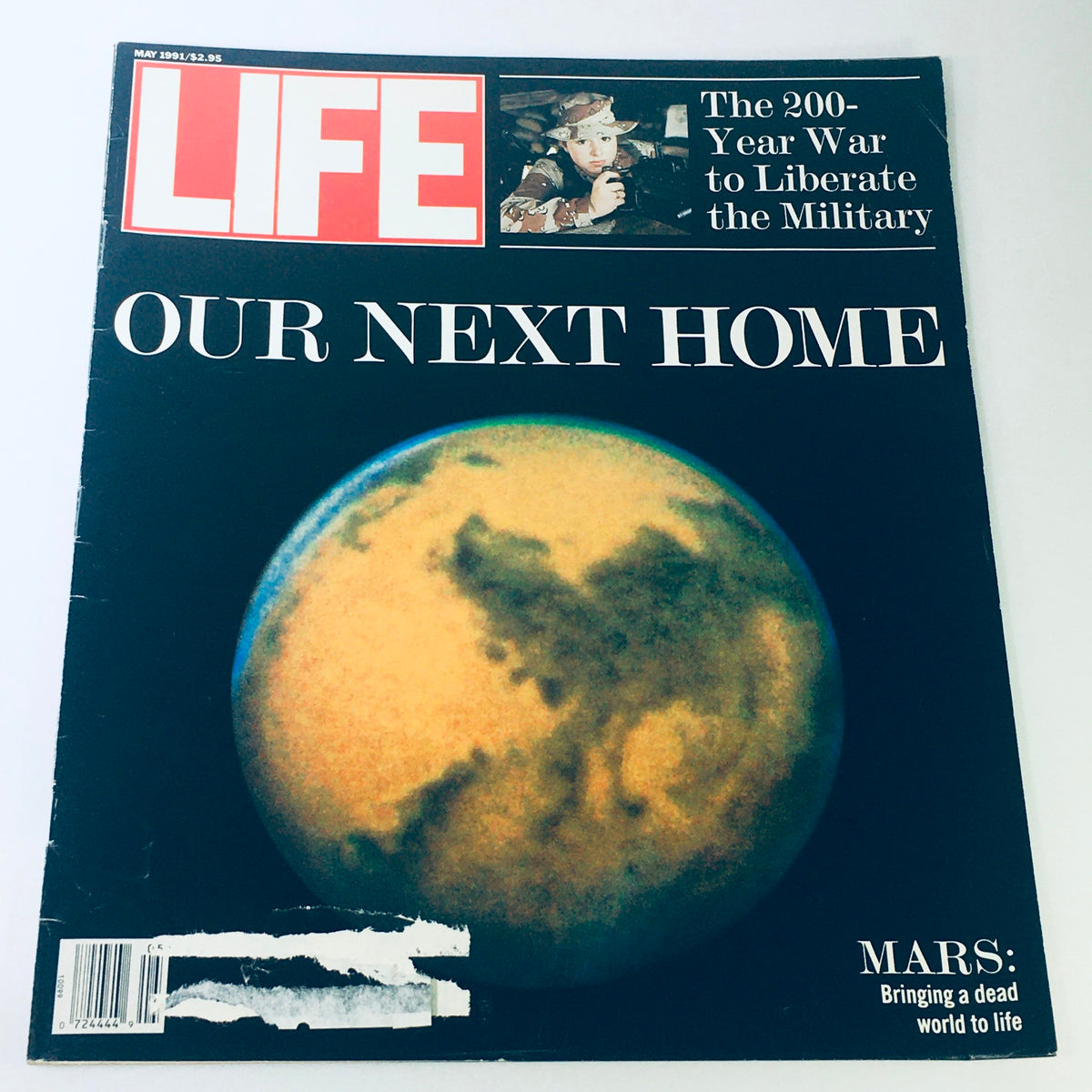 Cover of Life Magazine from May 1991 featuring the title 'Mars: Our Next Home' with a focus on space exploration and military liberation, showcasing a representation of Mars.