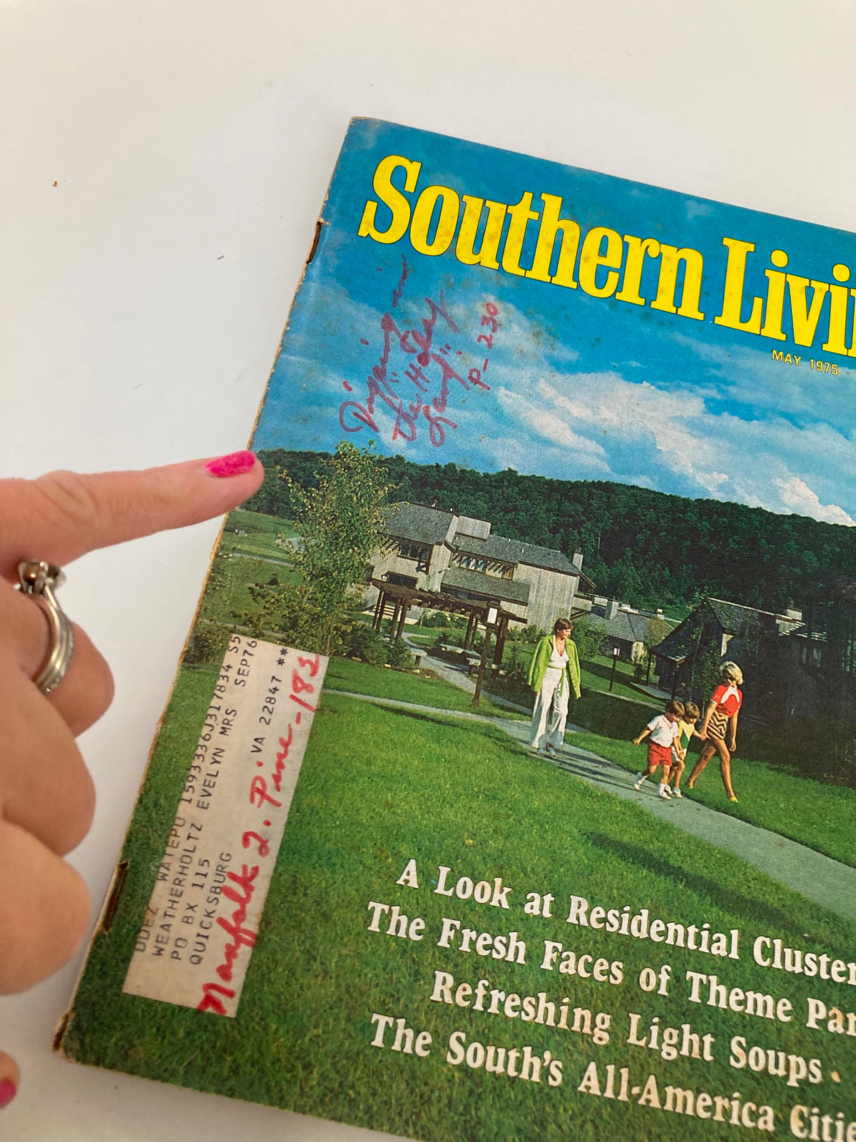 Close-up of the May 1975 Southern Living Magazine cover, highlighting the title 'The Fresh Faces of Theme Parks' with handwritten notes and address label.