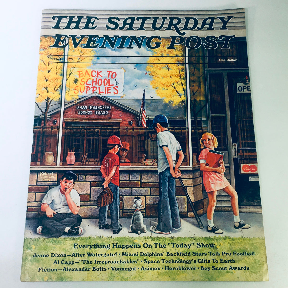 Cover of The Saturday Evening Post from September-October 1973 featuring a nostalgic scene of children near a school supplies stand, reflecting American culture. Includes contributions by Jeane Dixon and Al Capp.