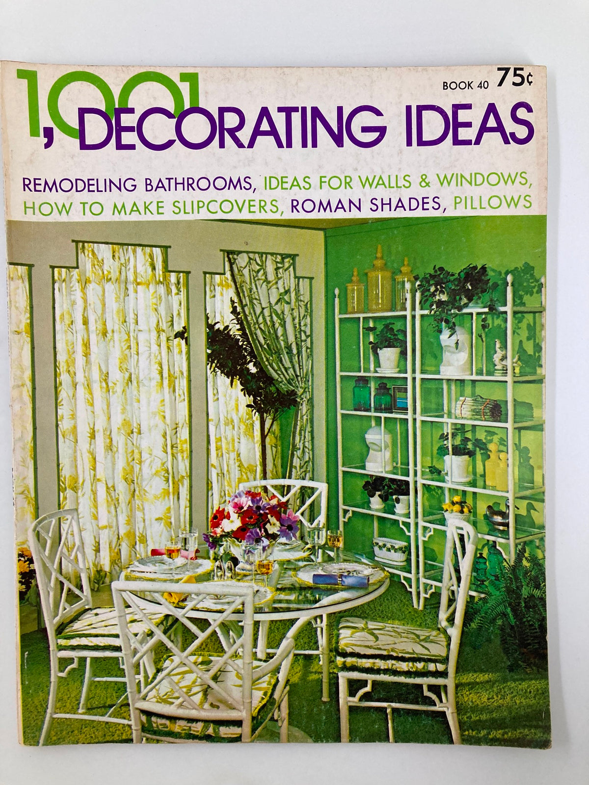 Cover of the VTG 1001 Decorating Ideas Magazine 1972 featuring home decor ideas, a vibrant green color scheme, and a stylish dining setup with floral curtains and a glass table.