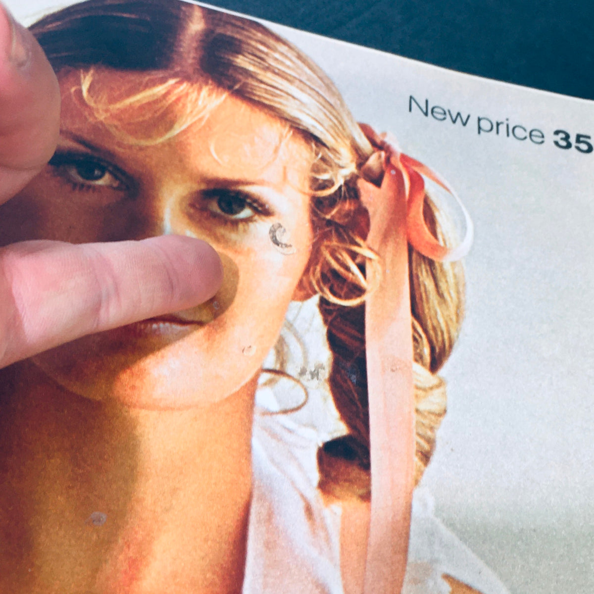 Another close-up of the Look Magazine March 9, 1971 showing a female model with long hair tied with a ribbon, highlighting condition details indicating age and use.