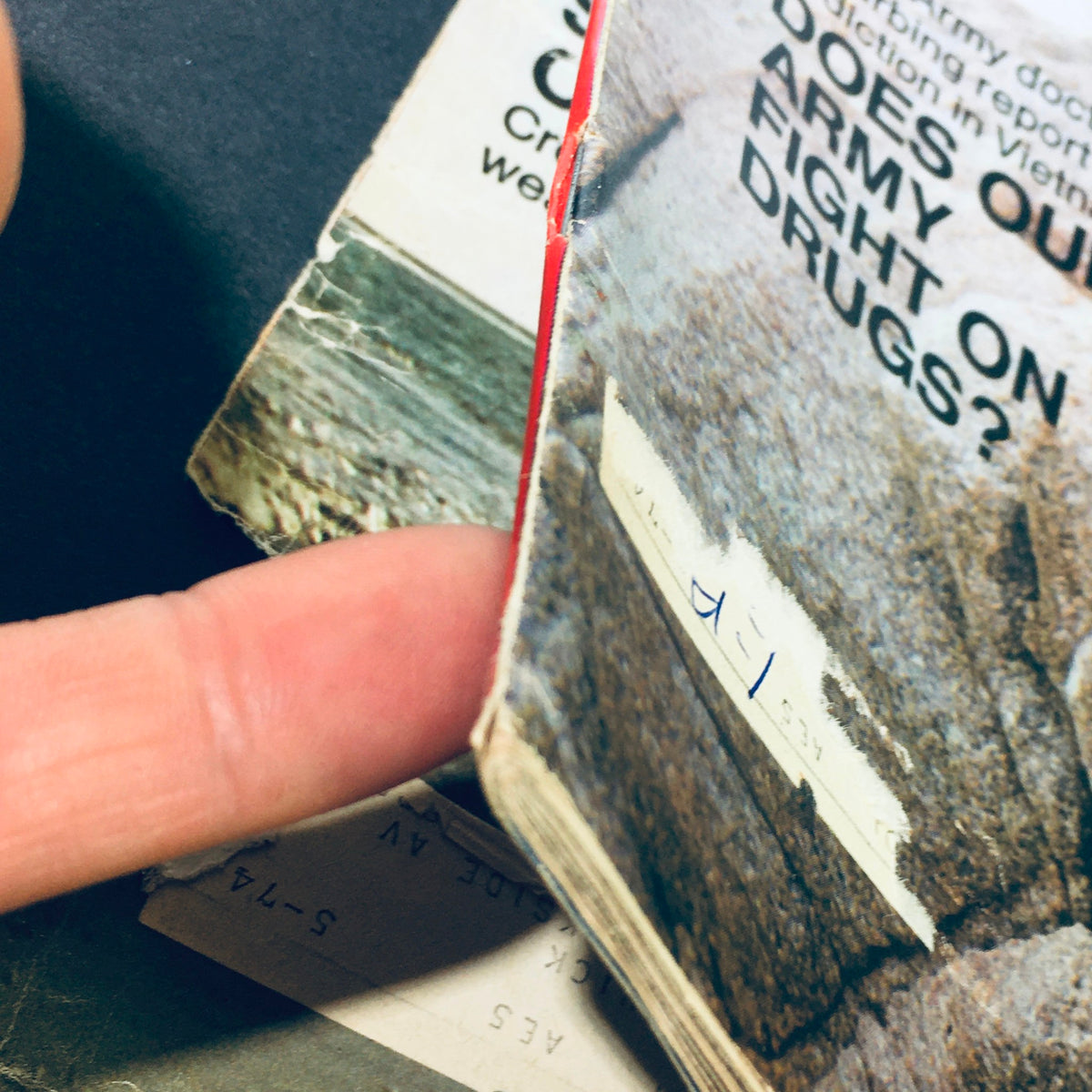 Close-up of the damaged spine of VTG Look Magazine June 16 1970, highlighting the historical wear of a vintage publication.