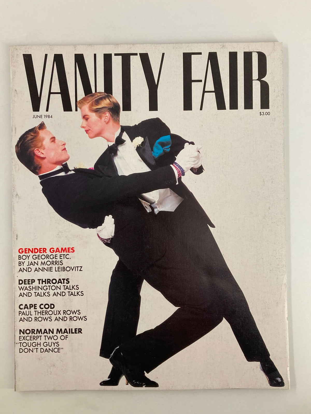 Cover of VTG Vanity Fair Magazine June 1984 featuring the title 'Gender Games' with imagery depicting two individuals in formal wear, showcasing 1980s fashion and cultural themes. This collectible magazine highlights Boy George and various articles relevant to gender identity and cultural movement of the era.