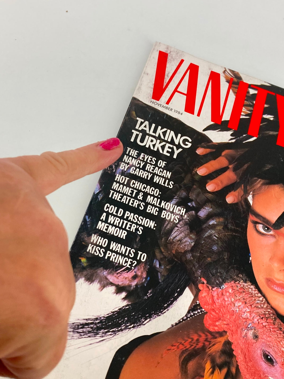 Cover of the VTG Vanity Fair Magazine November 1984 featuring Brooke Shields with the title 'Talking Turkey' and article previews including 'The Eyes of Nancy Reagan' and 'Who Wants to Kiss Prince?'. This collectible magazine highlights celebrity culture and fashion from the 1980s.