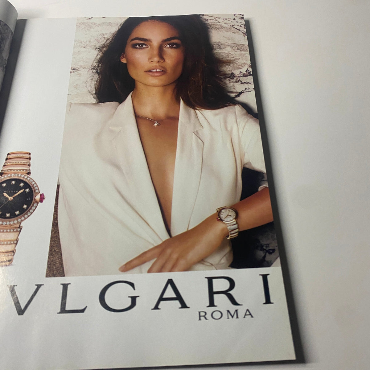 Advertisement page from Harper's Bazaar British Magazine January 2017 featuring a model showcasing a stylish outfit with a Bulgari watch.