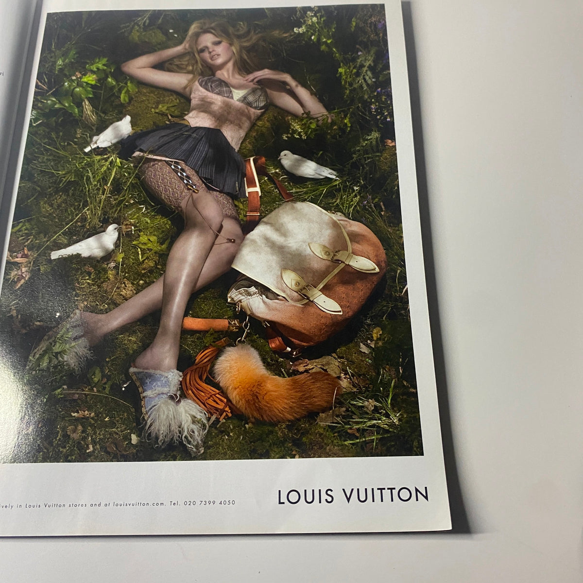 Advertisement page from Harper's Bazaar UK Magazine July 2010 showcasing a Louis Vuitton campaign, highlighting luxury fashion.
