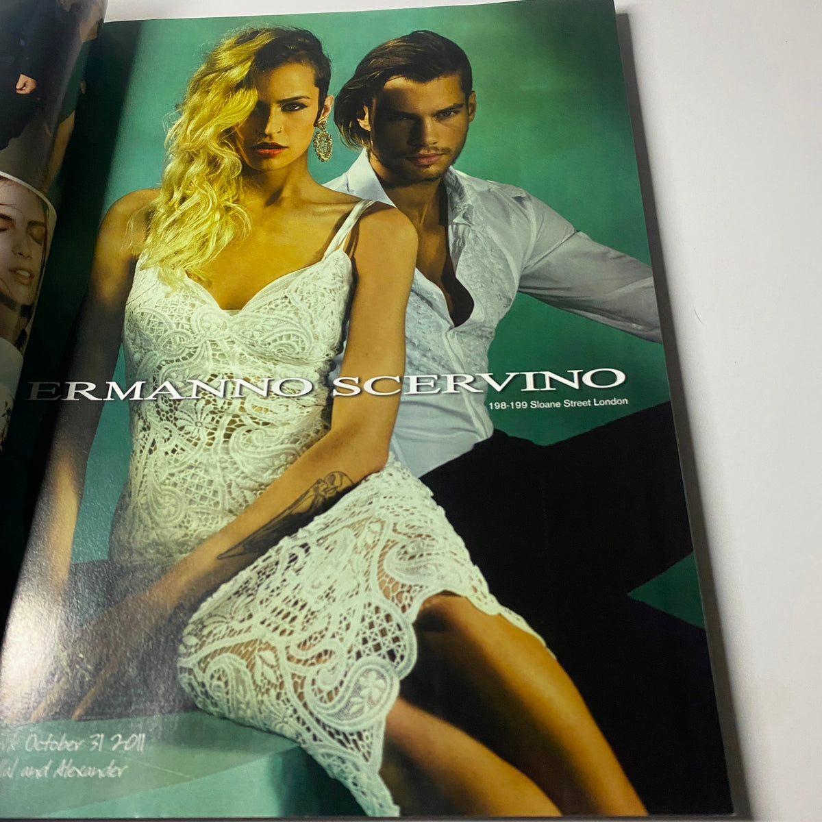 An advertising page inside Harper's Bazaar UK Magazine February 2012 featuring a fashion model showcasing a design by Ermanno Scervino.