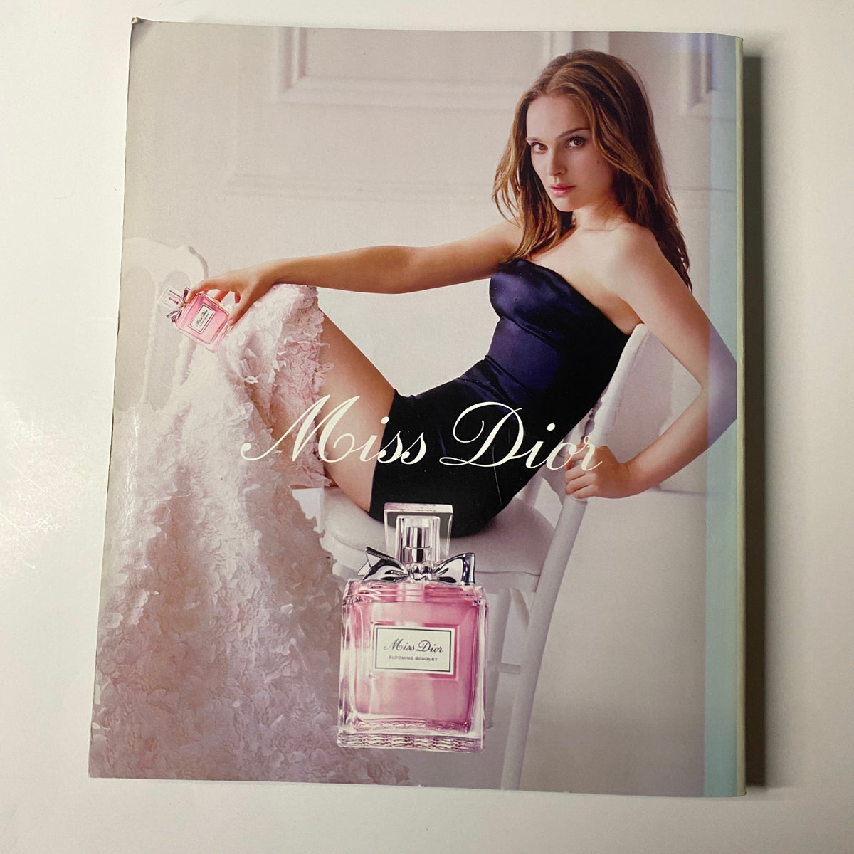 Harper's Bazaar Magazine March 2015 displaying a glamorous Miss Dior fragrance advertisement with a model in an elegant pose.