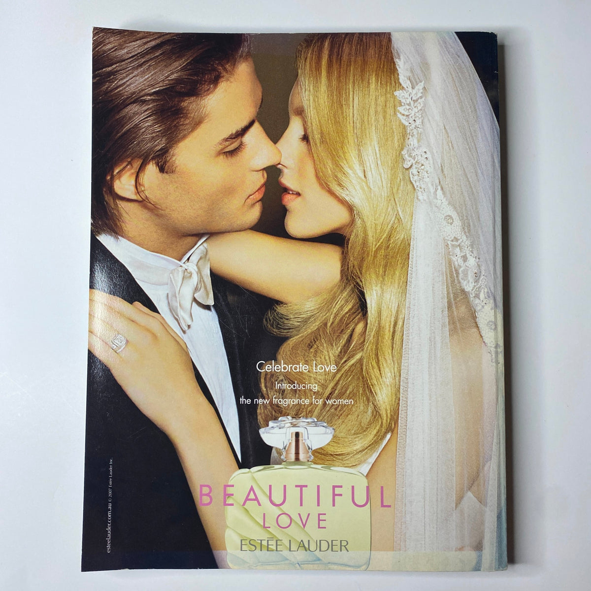 Harper's Bazaar Australia Magazine March 2007 introducing an Estée Lauder advertisement for Beautiful Love fragrance with a romantic couple.