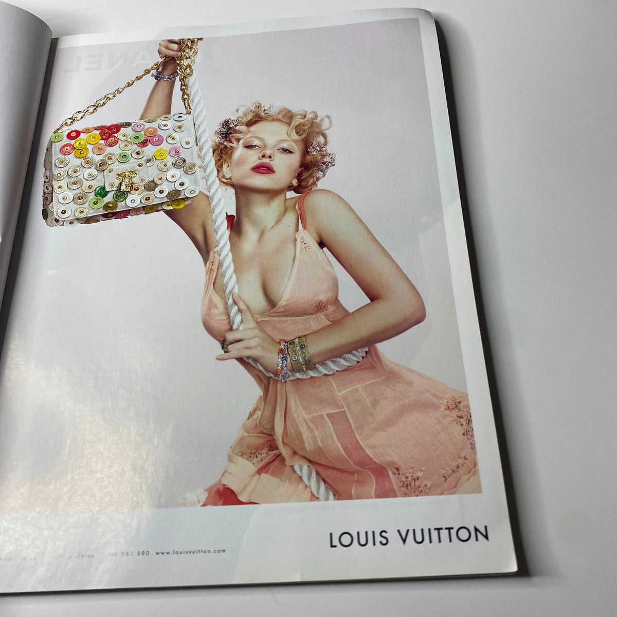 Fashion spread from Harper's Bazaar Australia Magazine June - July 2007 featuring a model with a Louis Vuitton bag, representing luxury fashion.