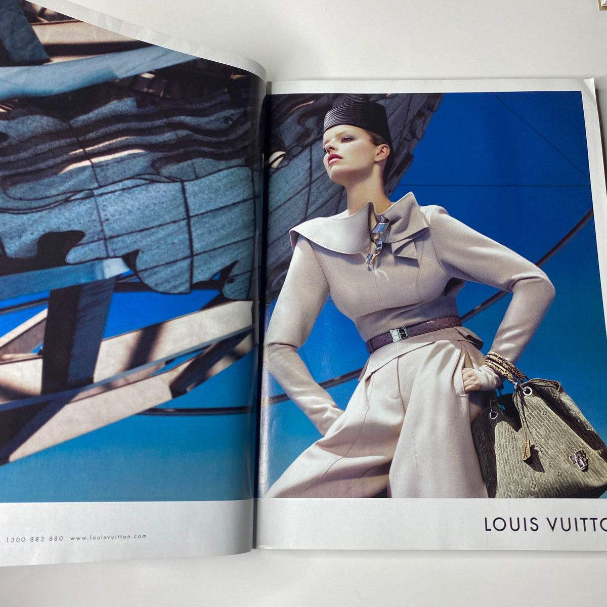 Harper's Bazaar Australia Magazine December 2008 spread showcasing Louis Vuitton fashion with a model in sophisticated attire against a striking backdrop.