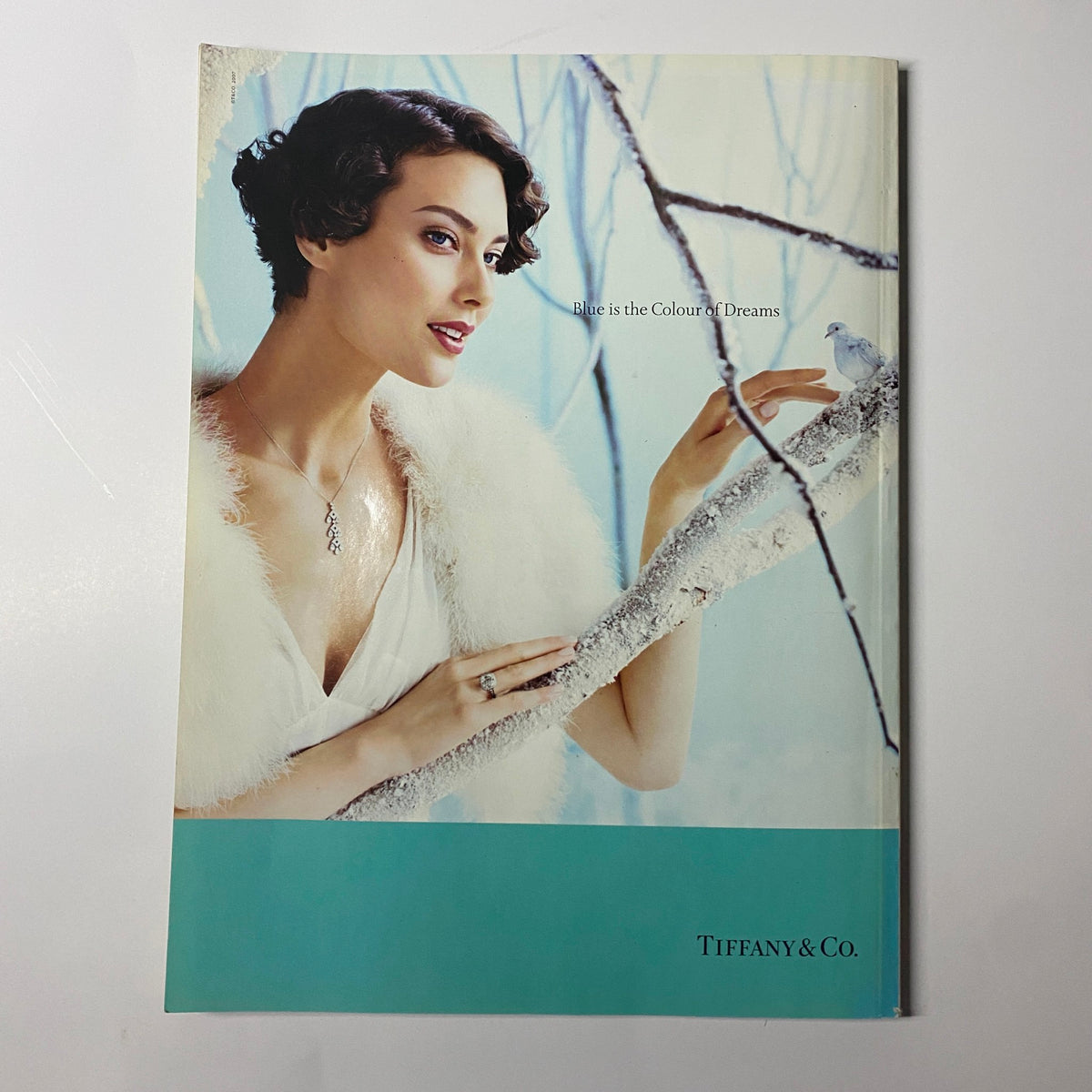 Harper's Bazaar British Magazine January 2008 advertisement for Tiffany & Co., portraying a model in an elegant setting, promoting the theme 'Blue is the Colour of Dreams'.