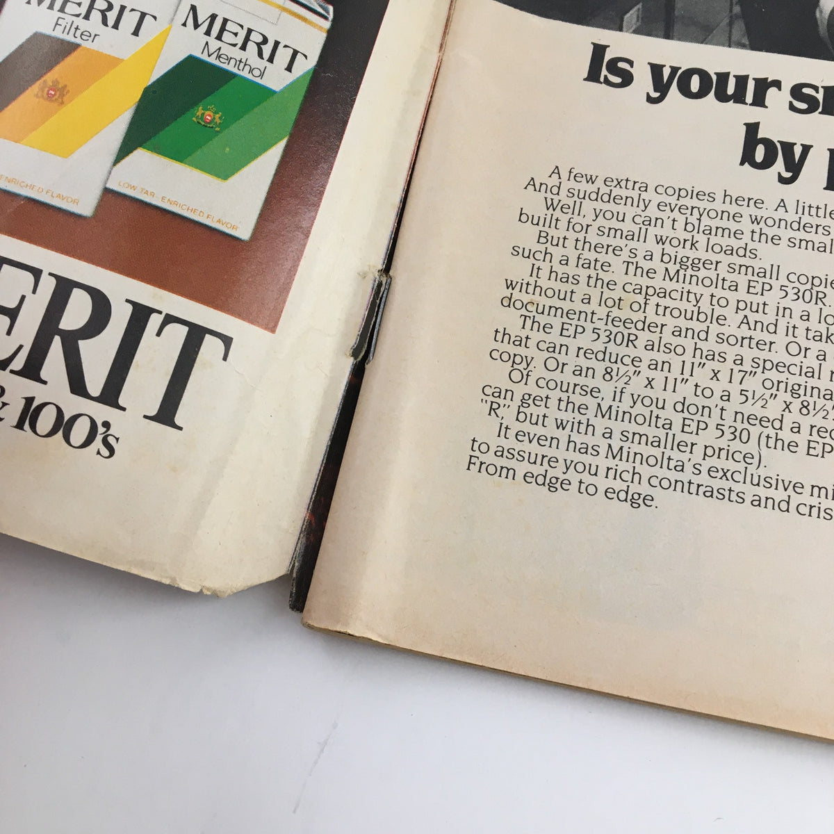 Inside page of Newsweek Magazine April 19, 1982, featuring advertising for Merit cigarettes and information about the Minolta EP 530R photocopier.