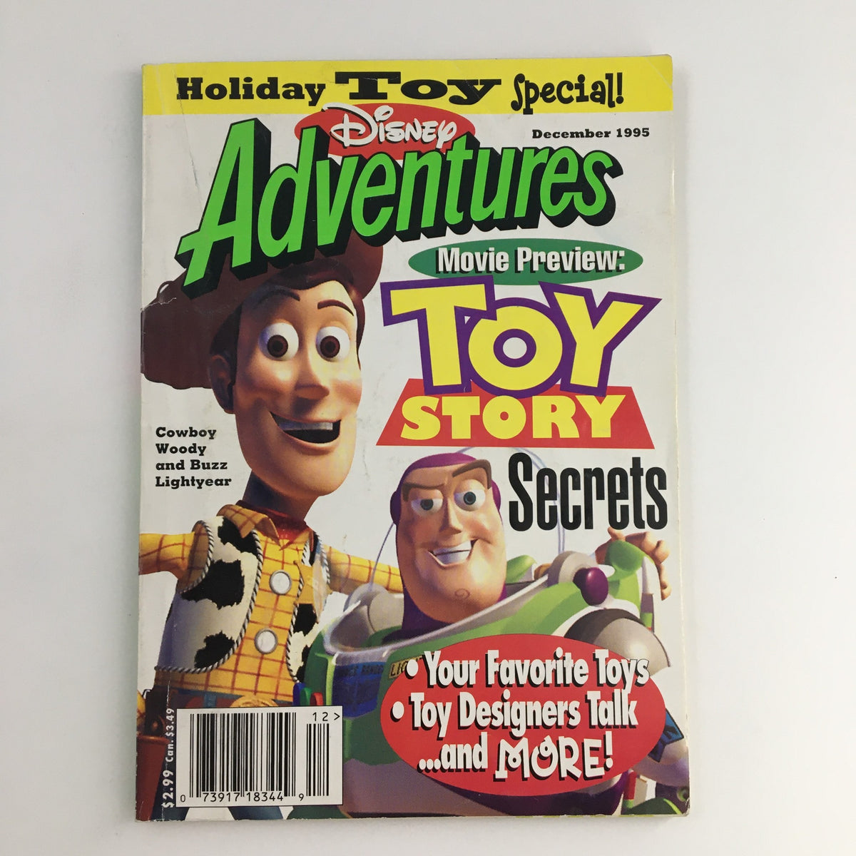 Cover of Disney Adventures Magazine December 1995 featuring Cowboy Woody and Buzz Lightyear from Toy Story. Highlights include movie preview of Toy Story and toy secrets.