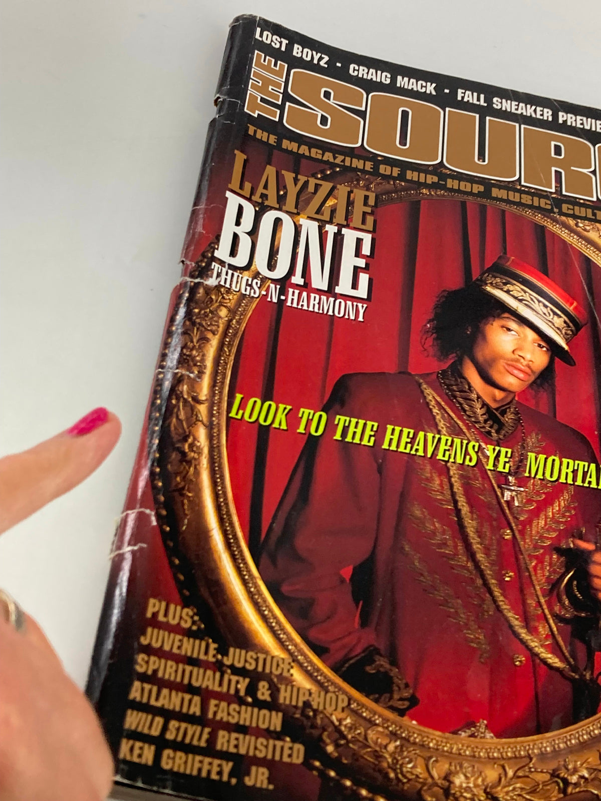 Close-up of The Source Magazine August 1997 cover with Layzie Bone from Thugs-N-Harmony, highlighting details of the vintage issue and its artistic elements.