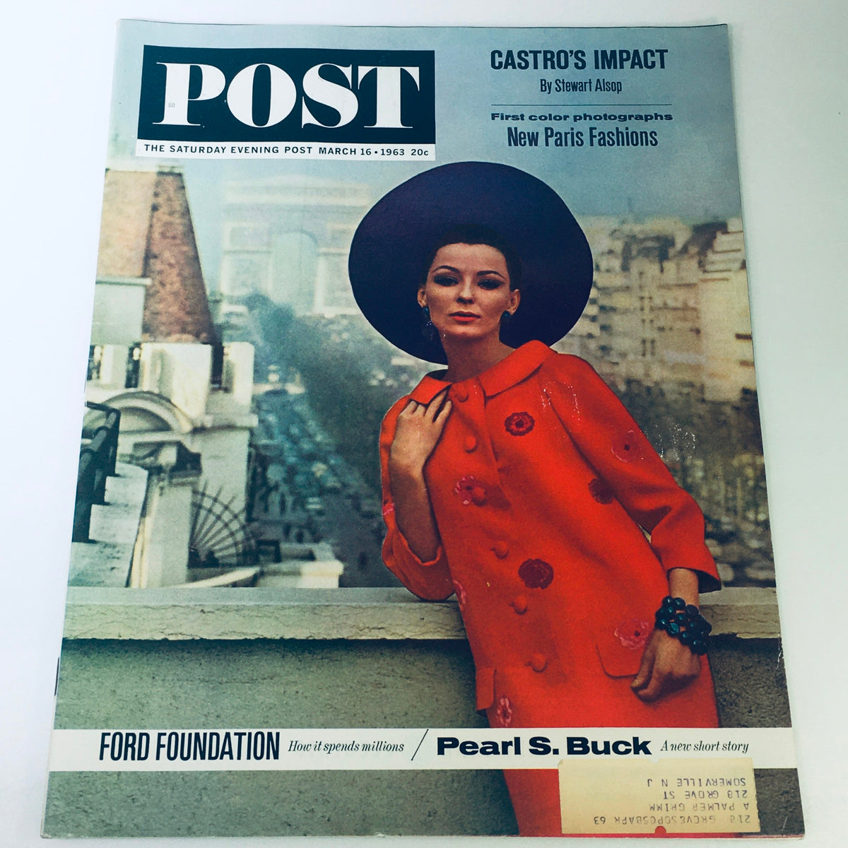 VTG The Saturday Evening Post March 16 1963 cover featuring a model in a bright orange coat and large hat, spotlighting New Paris fashion trends.