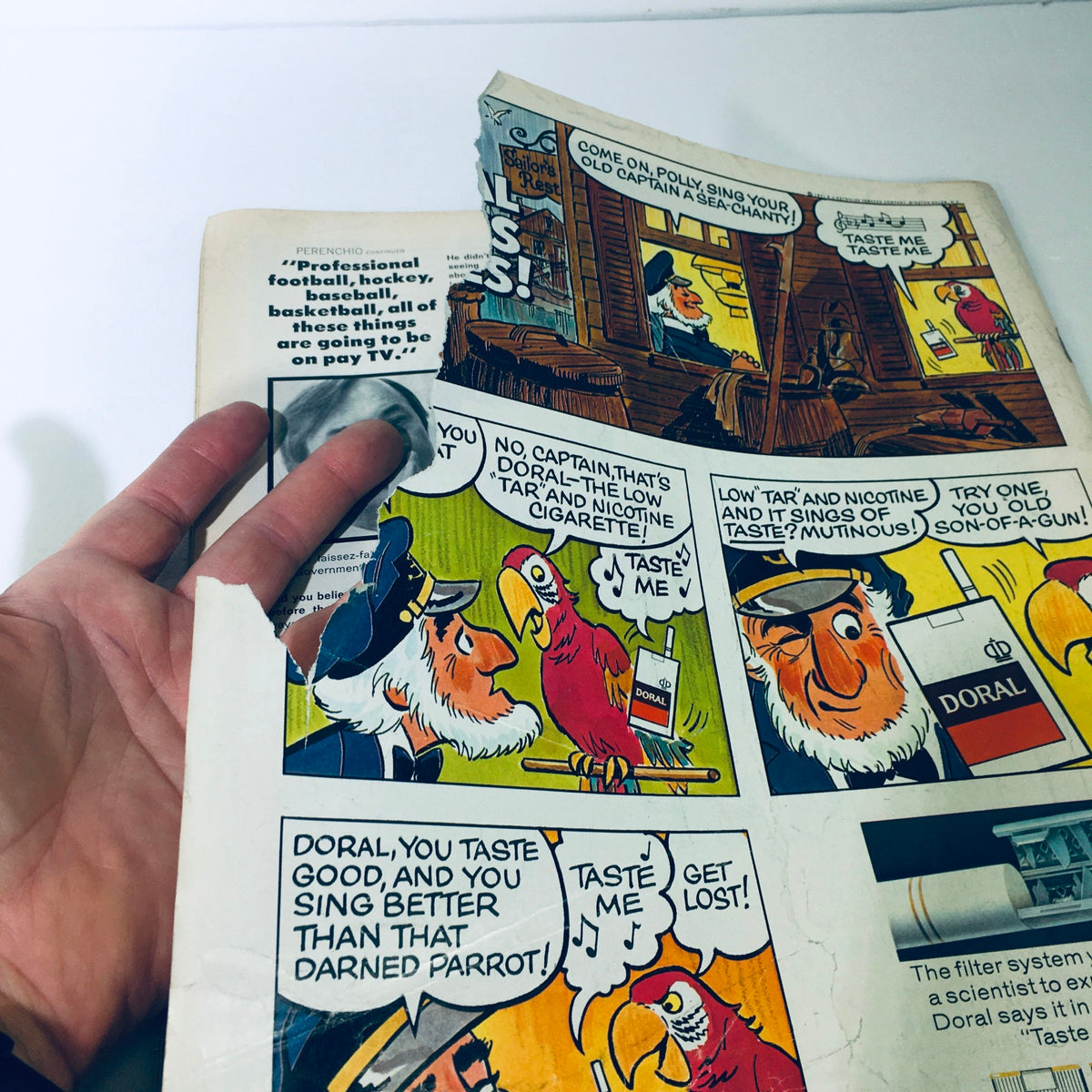 Close-up view of a vintage comic strip featuring a pirate and a parrot discussing Doral cigarettes, from the VTG Look Magazine June 1, 1971 - Howard Hughes / Julie Christie & Warren Beatty.