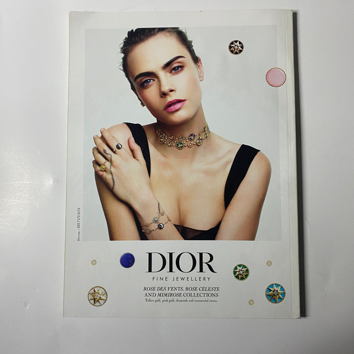 Dior Fine Jewellery advertisement featuring a model showcasing elegant accessories with a focus on the Rose des Vents, Rose Celeste, and Miroir collections.