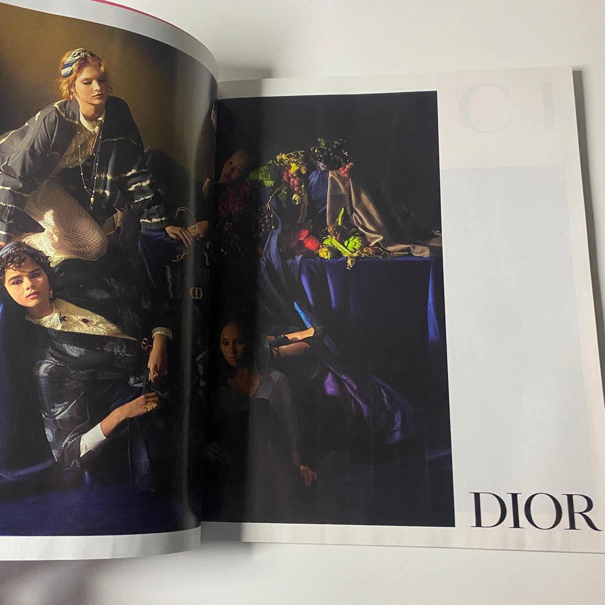 Dior fashion editorial from Harper's Bazaar Magazine February 2021 highlighting an elegant arrangement of models in sophisticated attire amidst a luxurious backdrop.