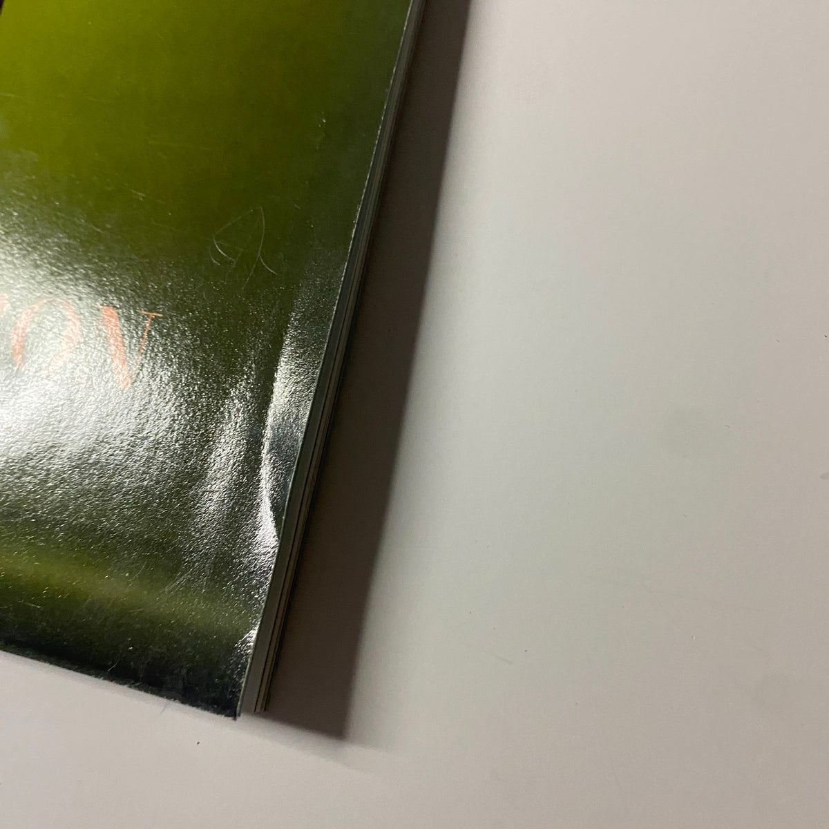 Close-up of the edge of the Harper's Bazaar Magazine August 2022 edition, showing minor wear on the corners of the cover.