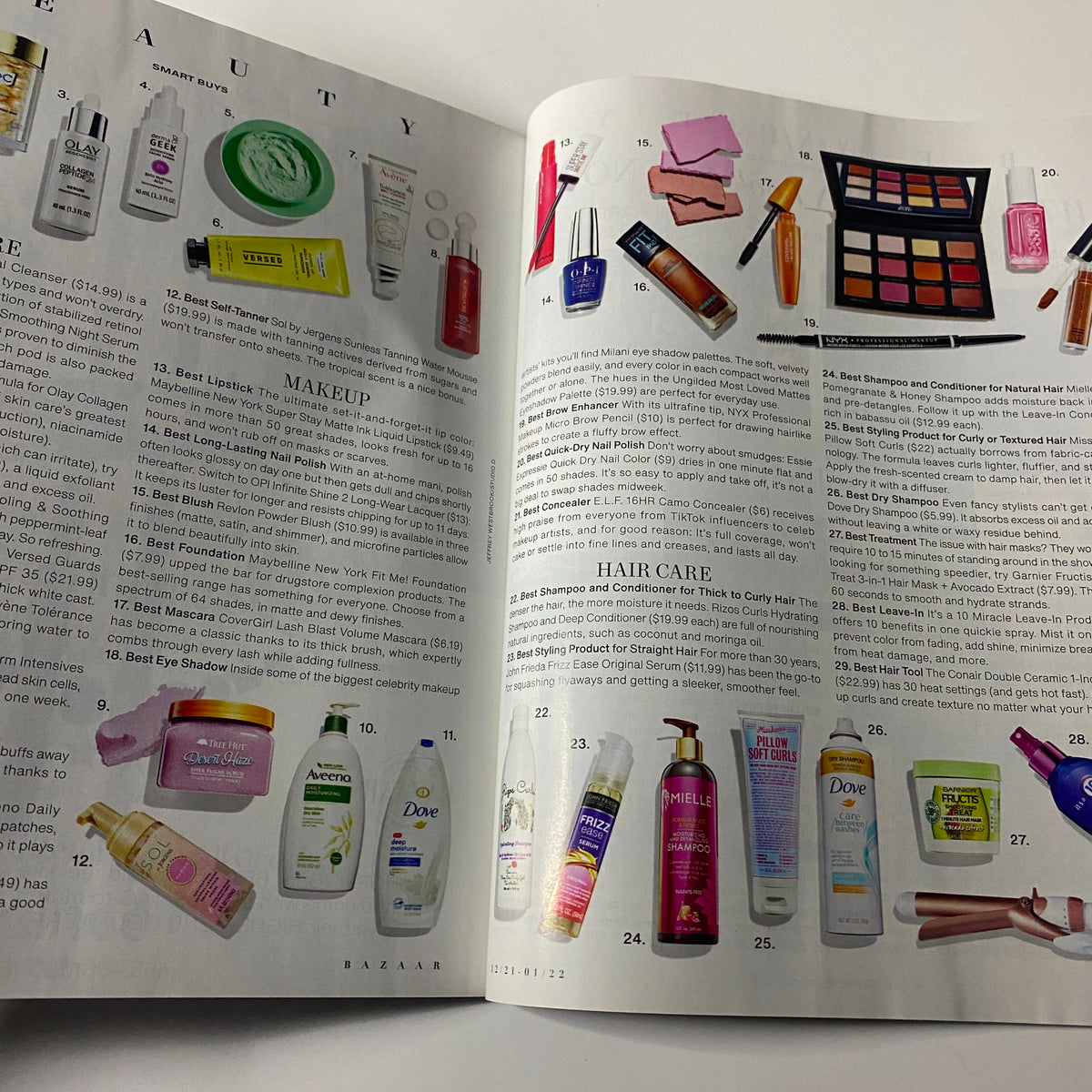 Inside spread of Harper's Bazaar Magazine December 2021 featuring beauty products, including skincare and makeup recommendations, showcasing the latest trends in hair care and cosmetics.