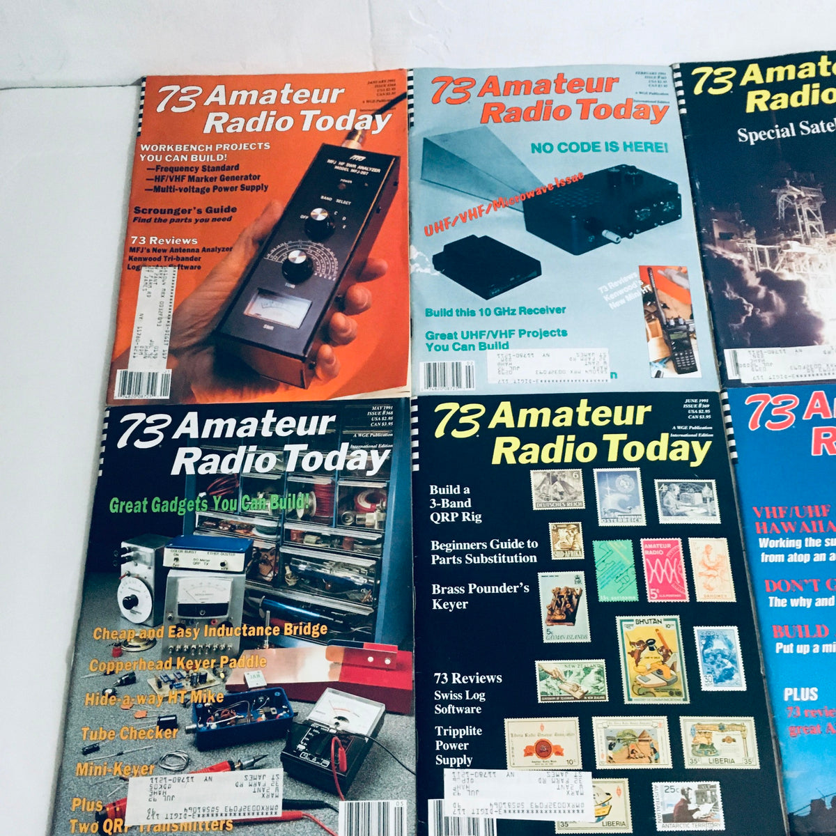 Lot of 12 Complete January to December 1991 73 Amateur Radio Volume 1 to 12. Detailed view of magazine covers showcasing amateur radio equipment and DIY projects.