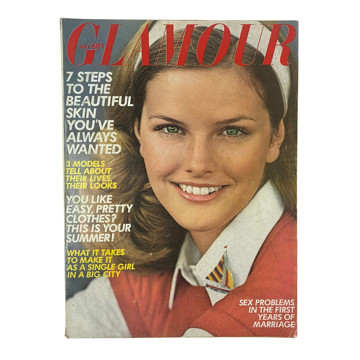 Glamour Magazine May 1972 Cover Look featuring a smiling model with green eyes wearing a red outfit and white collar, highlighting articles on beauty and relationships.