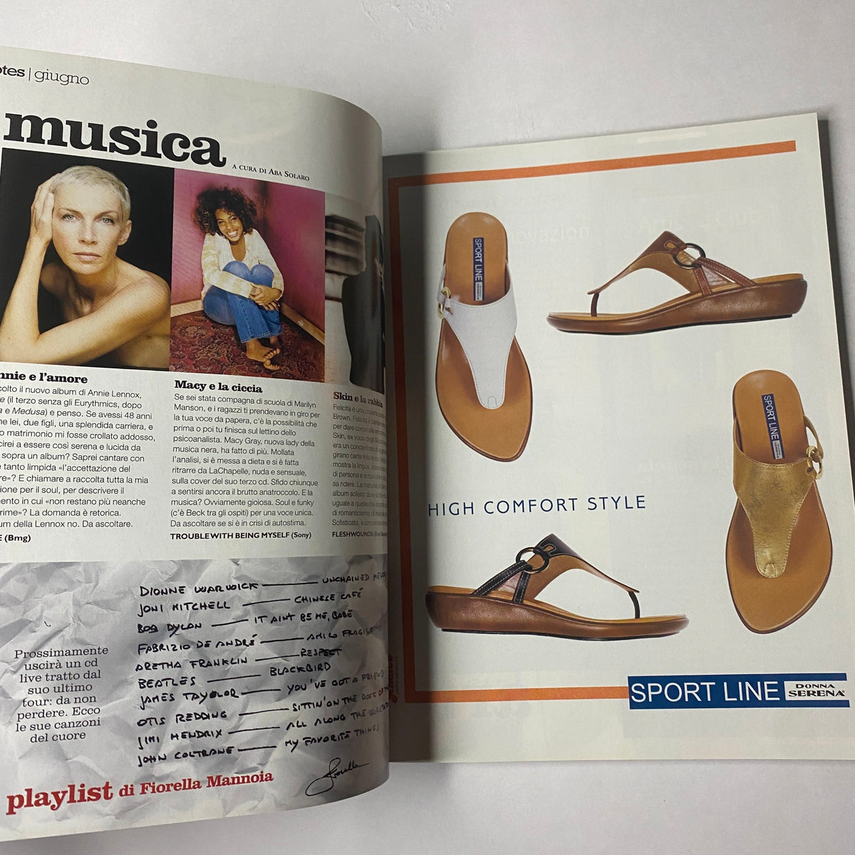 Open spread from Marie Claire Italia Magazine June 2003 displaying an advertisement for comfortable sandals alongside a featured article, highlighting the magazine's fashion promotions.
