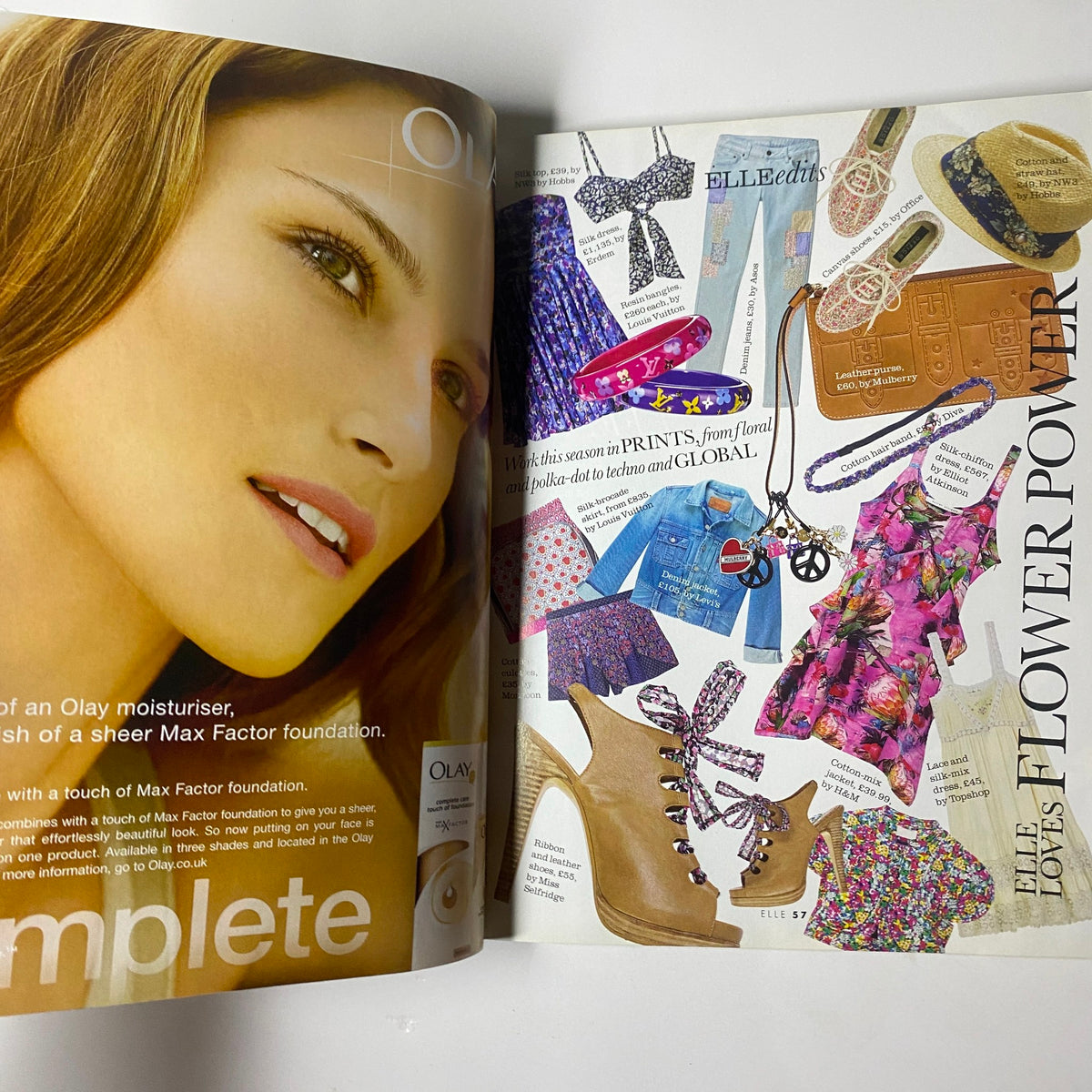 Advertisement for Olay moisturizer from Elle UK Magazine May 2010, showcasing a model and summer fashion trends.