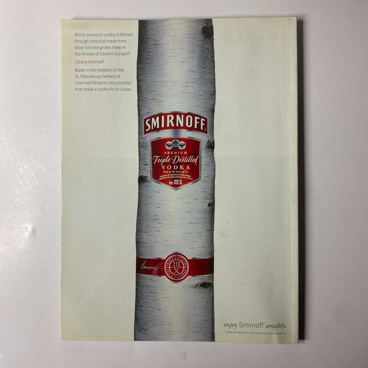 Image UK Magazine August 2006 advertisement for Smirnoff vodka, highlighting the brand's iconic bottle design and promoting enjoyment of vodka.