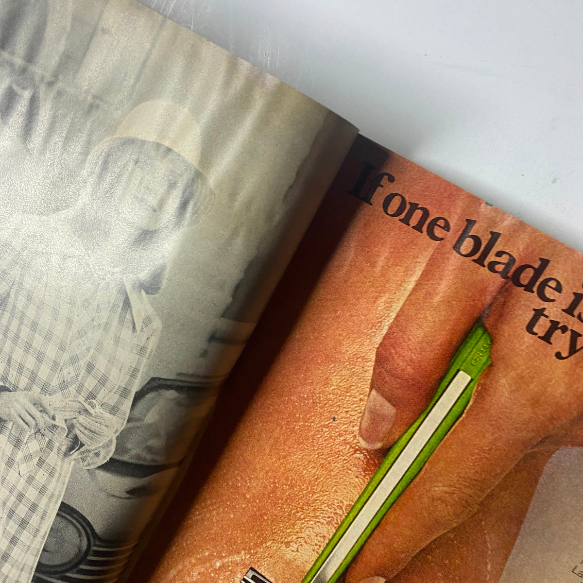 Close-up of a page from Cosmopolitan Magazine February 1974 featuring a vintage advertisement and a model, highlighting retro design elements.