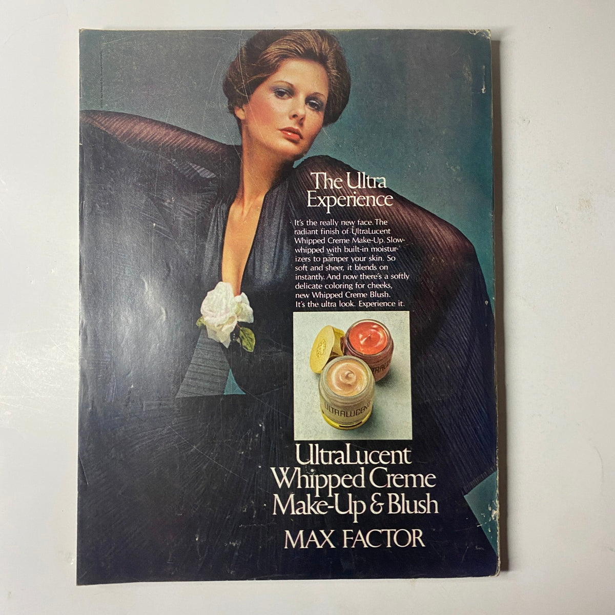 Back cover of Cosmopolitan Magazine February 1974 featuring an advertisement for Max Factor's UltraLucent Whipped Creme Make-Up & Blush, showcasing beauty products from the era.