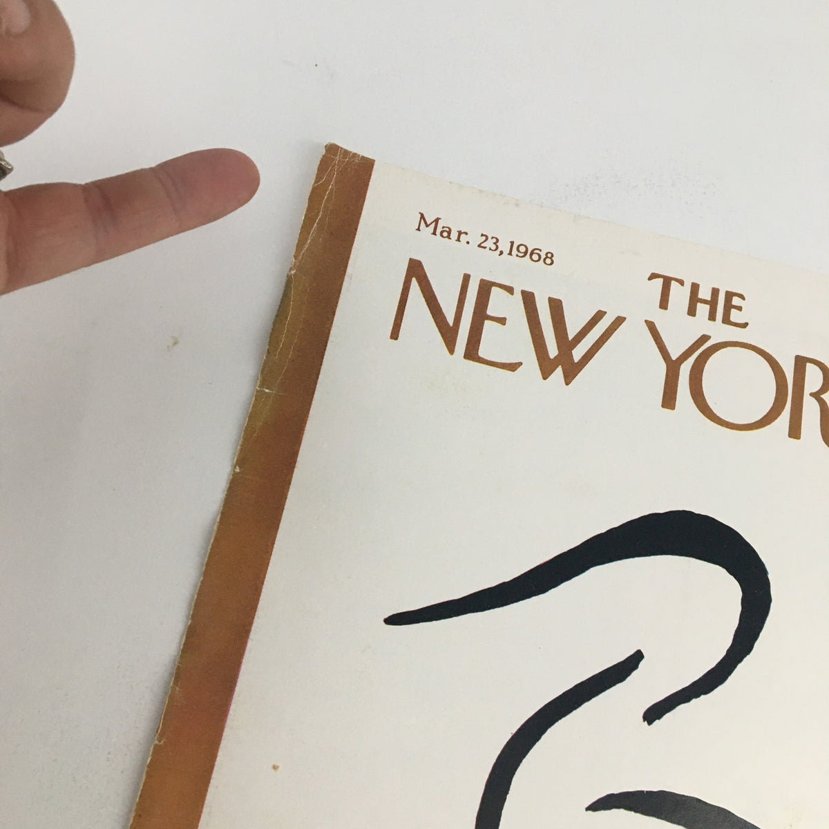 Detailed shot of The New Yorker cover from March 23, 1968, by artist Abe Birnbaum. The image includes the magazine title and date, along with a focus on the wear and vintage charm of the cover edges.