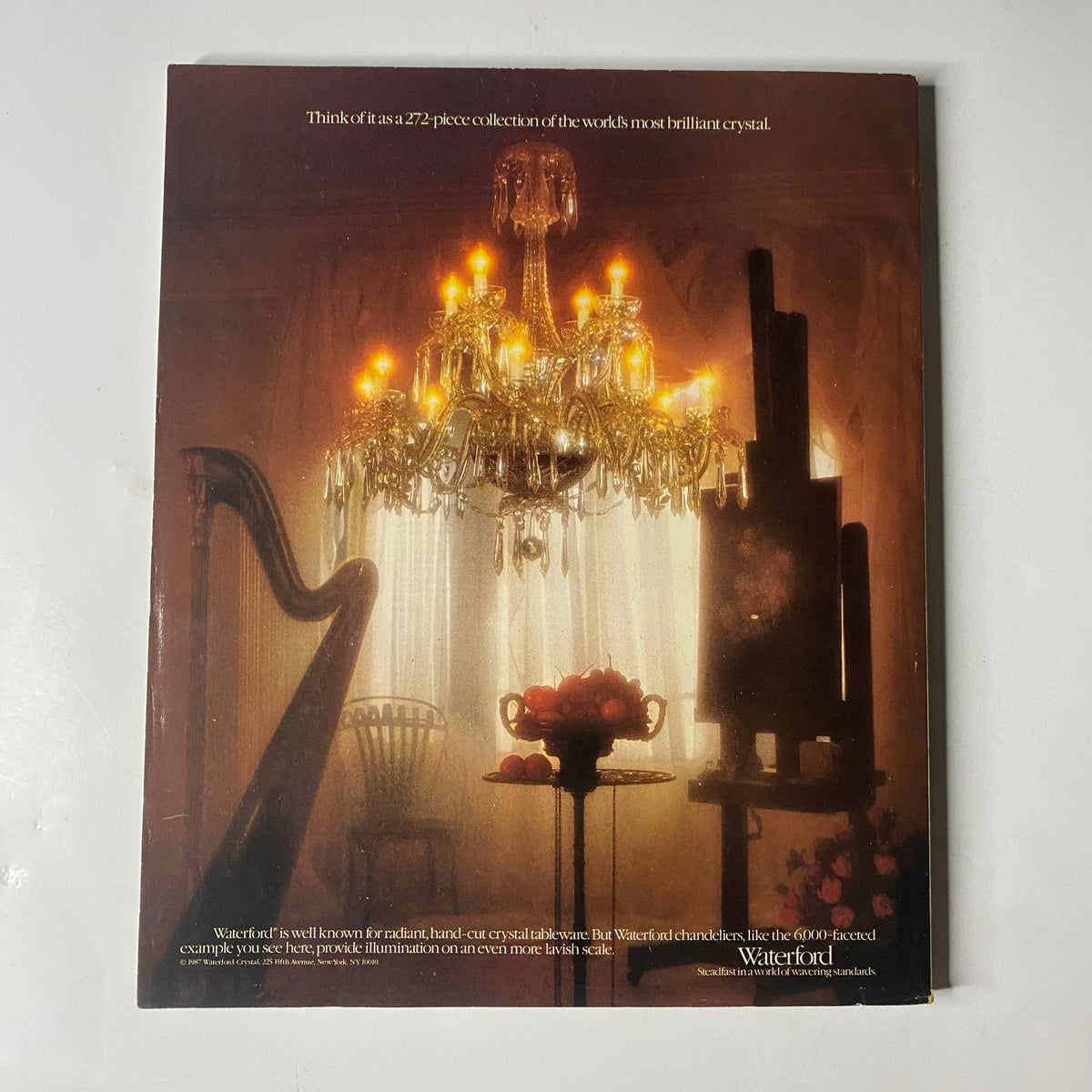 Back cover of Town & Country Magazine August 1987, featuring a Waterford crystal advertisement with a chandelier and floral arrangement, showcasing luxury brand products.