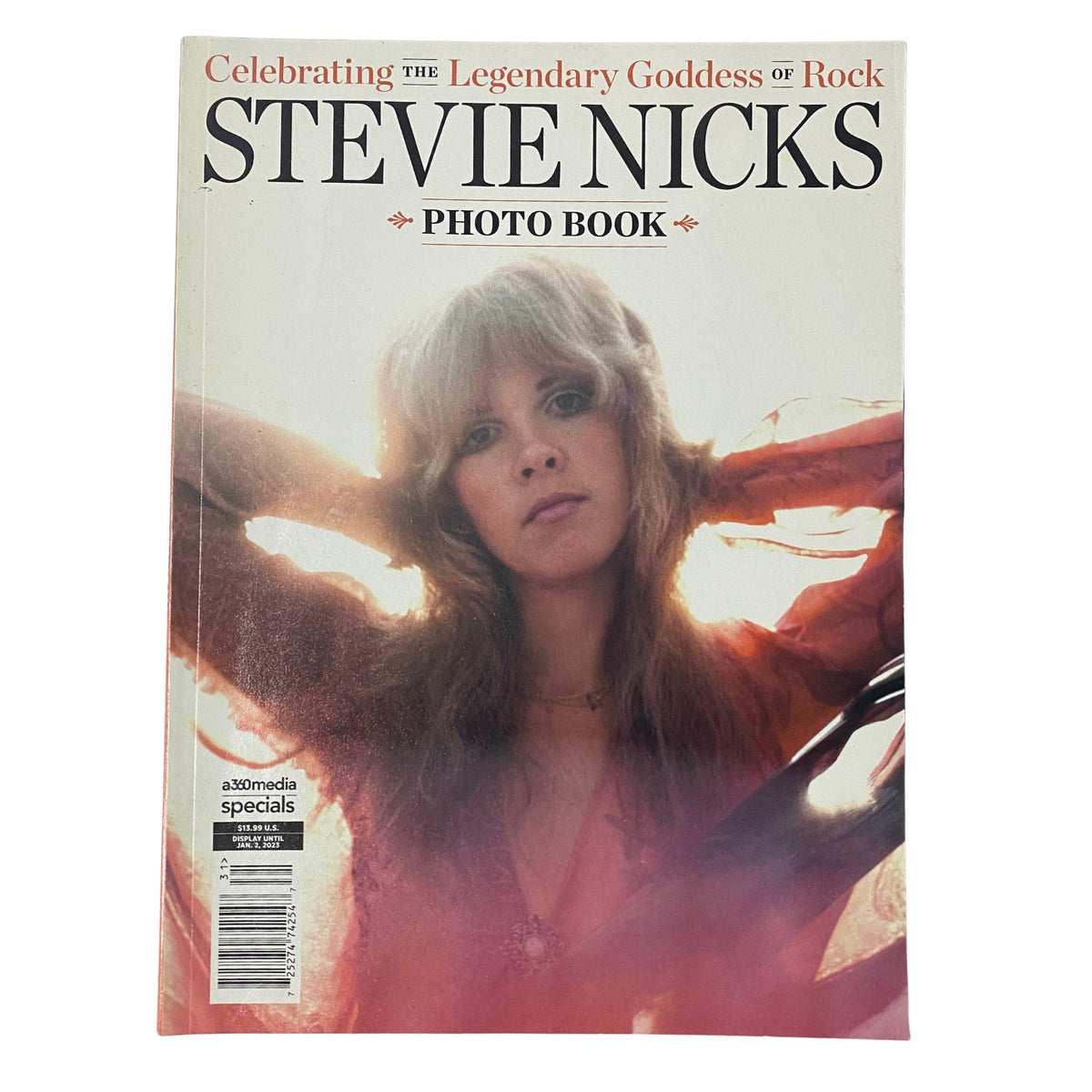 Cover of 'Stevie Nicks Photo Book' celebrating the legendary goddess of rock, featuring a portrait of Stevie Nicks in a flowing outfit, capturing her iconic style.