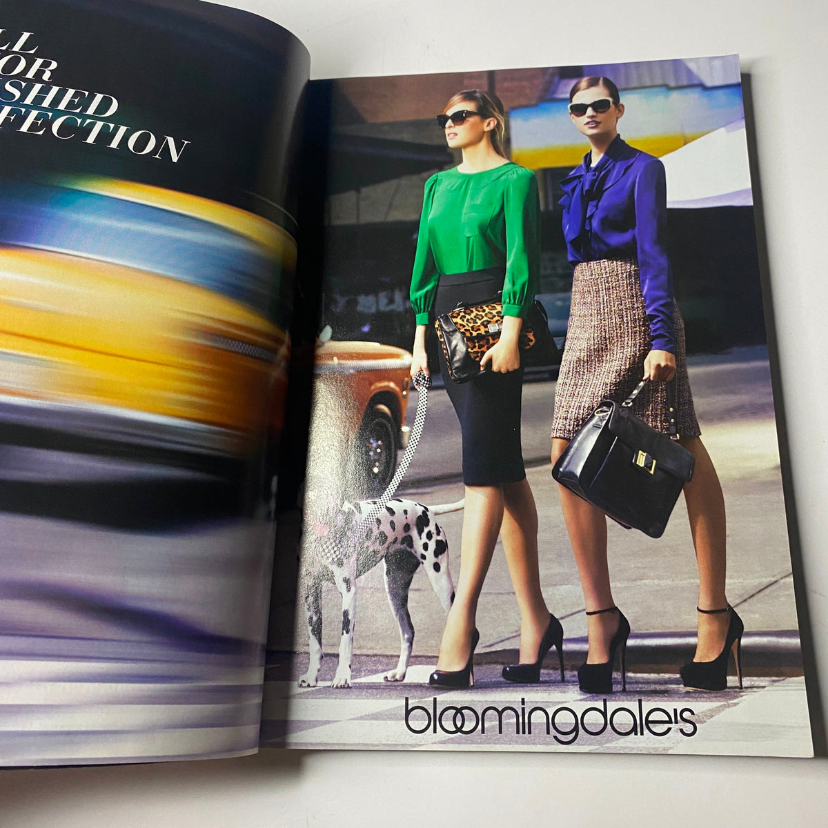 Bloomingdale's fashion advertisement featuring models in stylish outfits with a dog, from the pages of Vanity Fair Magazine October 2011, titled "Vanity Fair Magazine October 2011 Angelina Jolie Cover No Label VG".