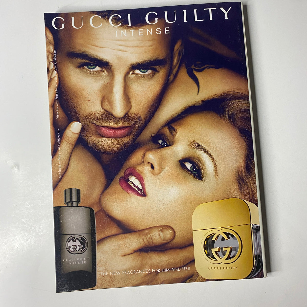 Gucci Guilty Intense Magazine Ad featuring a couple, showcasing the new fragrances for him and her, with an elegant design, highlighting the Vanilla Fair Magazine October 2011 Angelina Jolie Cover.