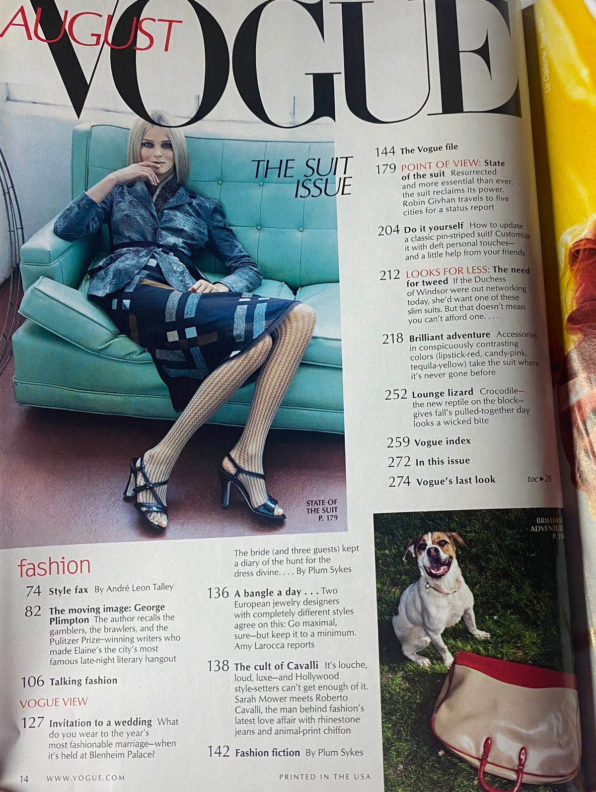August 2000 Vogue Magazine featuring Carmen Kass on the cover, showcasing high fashion and the editorial collection titled 'The Suit Issue'. The layout highlights fashion insights and styles of the early 2000s in very good condition.
