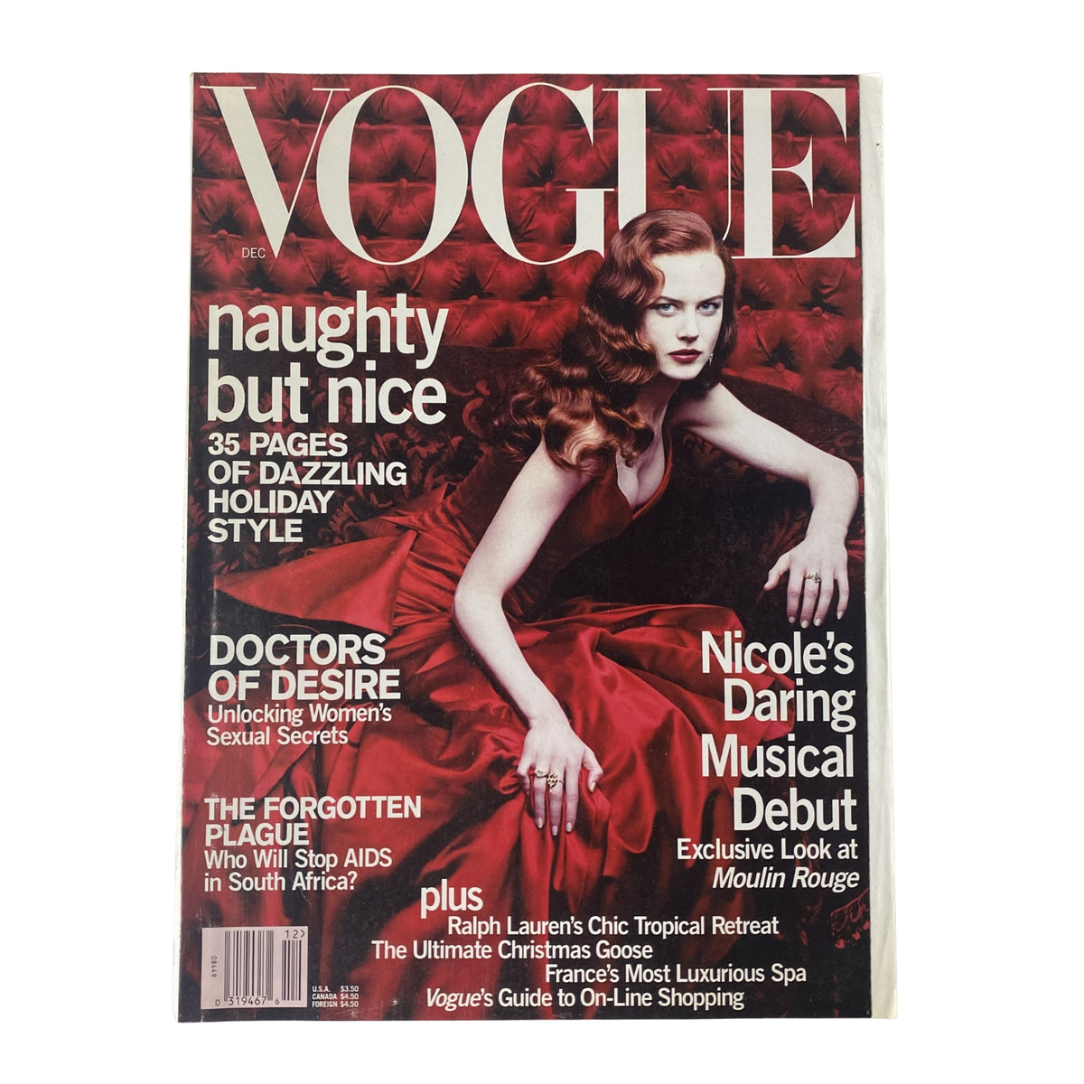 Vogue Magazine December 2000 Nicole Kidman Cover featuring a glamorous Nicole Kidman in a red gown, promoting the movie Moulin Rouge, in very good condition.