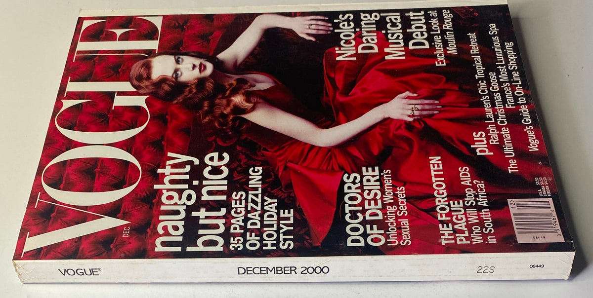 Vogue Magazine December 2000 with Nicole Kidman on the cover, showcasing the theme 'naughty but nice' and featuring a striking red dress.