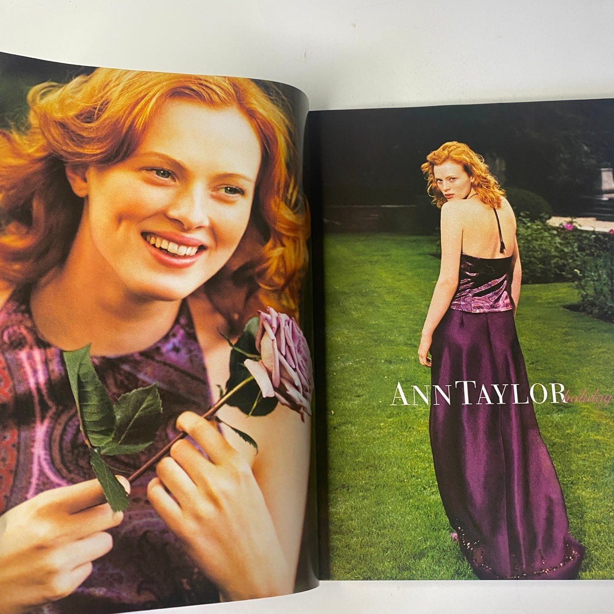 A spread from Vogue Magazine December 2000 featuring a model in a garden, showcasing Ann Taylor evening wear related to fashion highlights.