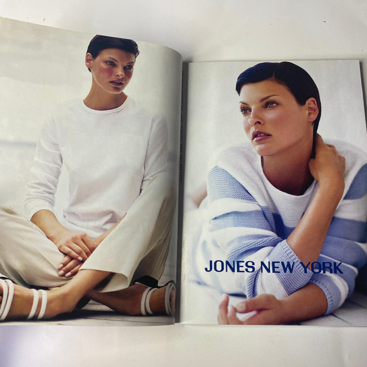 Fashion advertisement in Vogue Magazine January 1999 presenting a model in contemporary attire by Jones New York, promoting seasonal style.